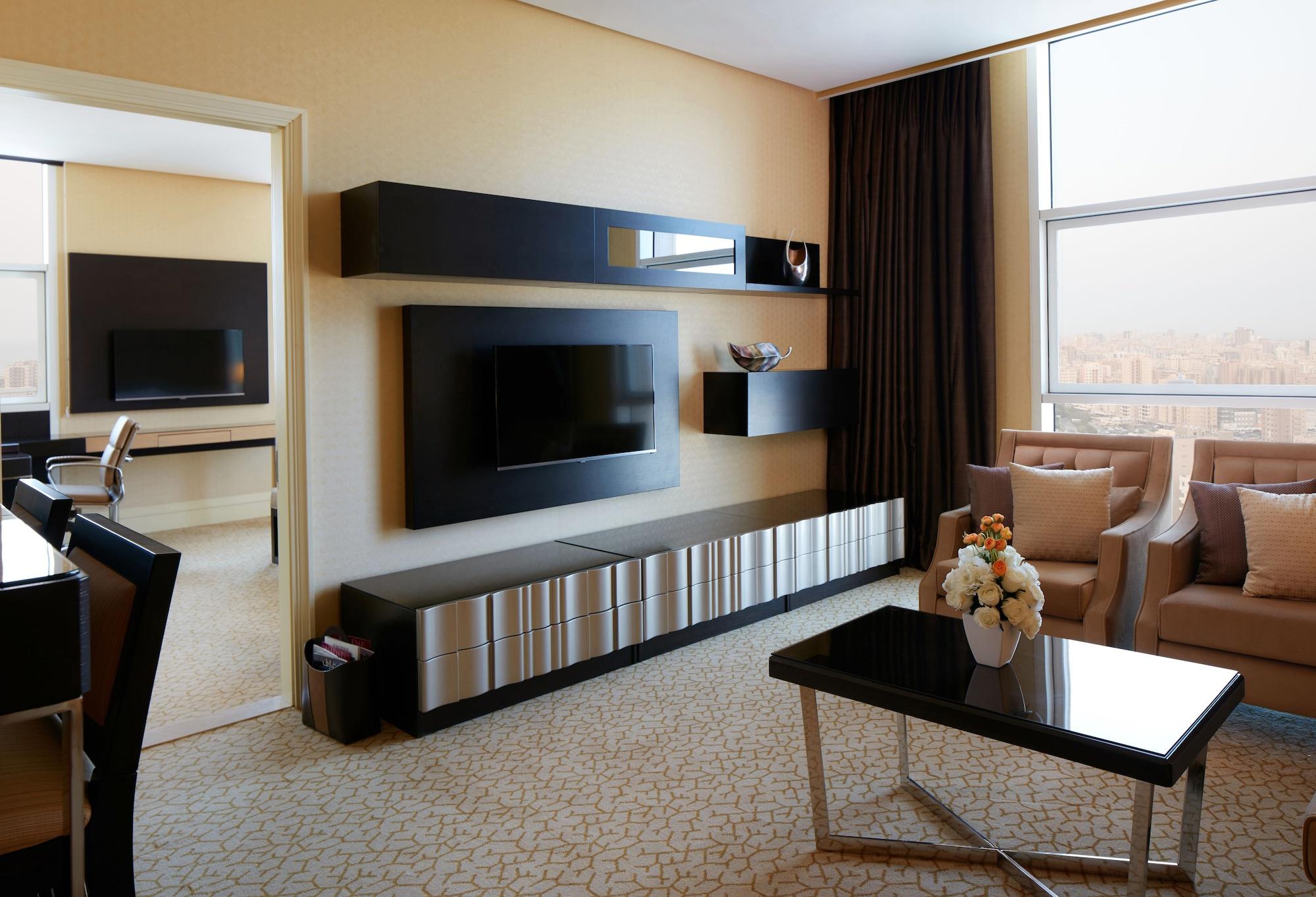 Millennium Hotel & Convention Centre Kuwait Kuveyt Dış mekan fotoğraf A living room with a television